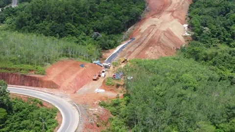 Aerial view of a mountain being excavated using an excavator for road const.. Stock Footage 325201724