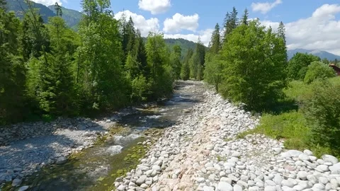 Aerial view of mountain brook or river flowing in the green valley. Beautiful Stock Footage 201269913
