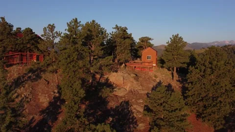 Aerial View of Mountain Cabin Overlooking the Colorado Rockies Stock Footage 219376496