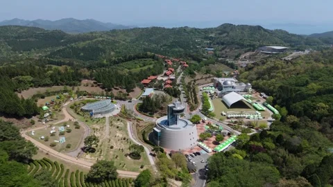Aerial View of Mountain Facility Complex Surrounded by Forest in South Korea 動画素材 325656225