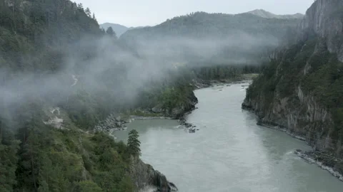 Aerial view mountain Katun river in between mountains and clouds Stock Footage 137874037