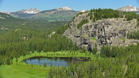 Aerial view of a mountain lake in the Beartooth mountains, Montana Stock Footage 260735619