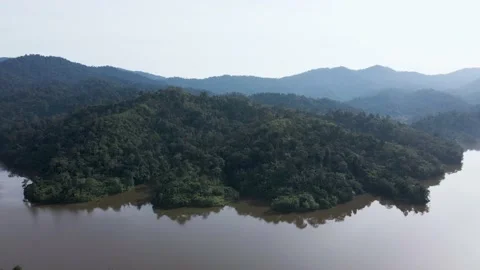 Aerial view at mountain lakeside with camera pan right in morning, Asia 動画素材 146882611