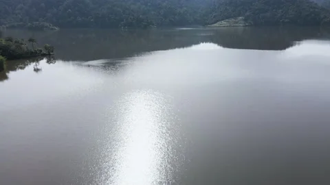 Aerial view at mountain lakeside with camera tilt up in morning, Asia 動画素材 147235598