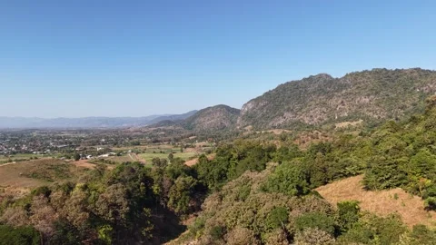 Aerial View of Mountain Landscape Under Clear Blue Sky Stock Footage 326176086