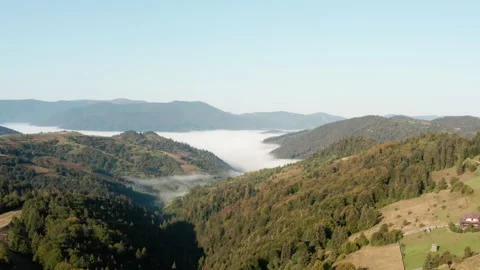 Aerial view. Mountain landscape. A valley covered with fog. Carpathians  Vídeo Stock 140214101