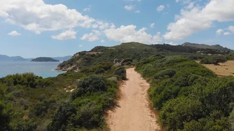 Aerial view of mountain path next to sea Video stock 90968373