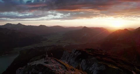 Aerial View of Mountain Peak at Sunset in the Alps with Summit Cross Stock Footage 236497864