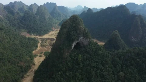 Aerial view of mountain range with cave in Vietnam Vídeo Stock 310330990