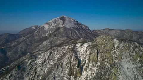 Aerial view of a mountain range with high cliffs. Stock Footage 304971803