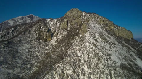 Aerial view of a mountain range with high cliffs. Stock Footage 304971823