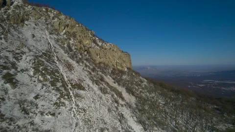Aerial view of a mountain range with high cliffs. Stock Footage 304971998