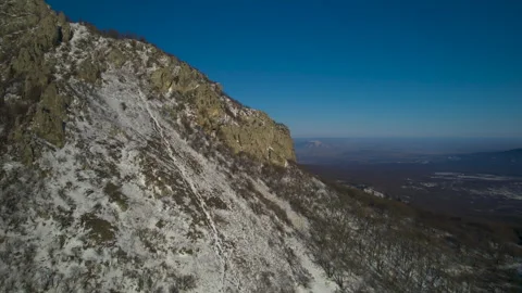 Aerial view of a mountain range with high cliffs. Stock Footage 304972198