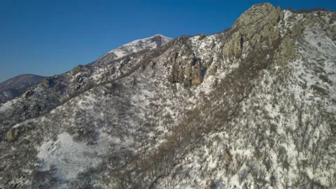 Aerial view of a mountain range with high cliffs. Stock Footage 304972329