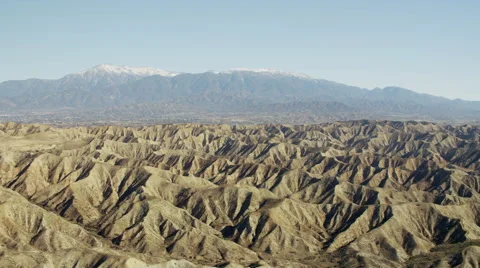 Aerial view of mountain range outside city of Los Angeles Stock Footage 64776769
