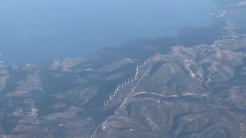 Aerial view of mountain range with road cutting through natural landscape 스톡 동영상 267511580