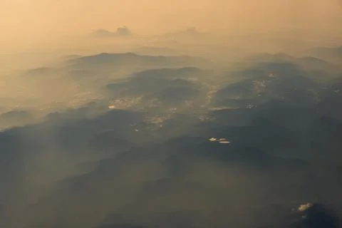 Aerial view of mountain range view from airplane in morning. Stock Photos