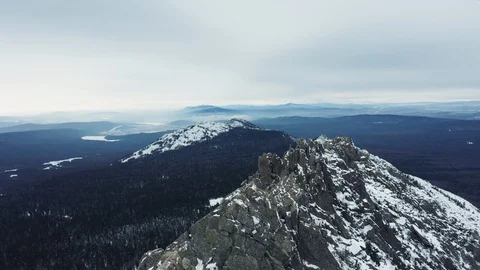Aerial view of mountain range in winter day, drone moves sideways Stock Footage 120820858
