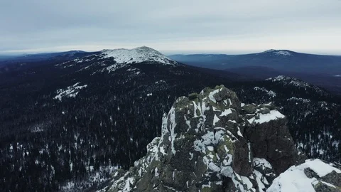 Aerial view of mountain range in winter day, drone moves forward Stock Footage 120821665