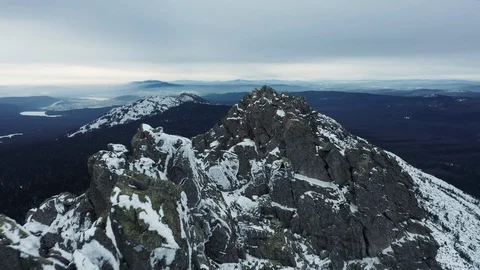 Aerial view of mountain range in winter day, drone moves backward Stock Footage 120823138