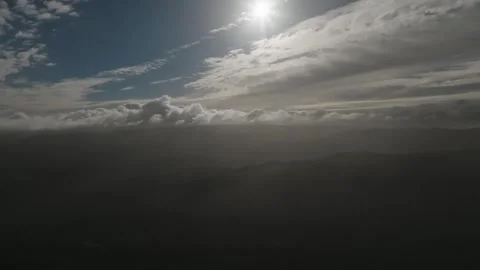 Aerial view Mountain Reflections on Calm Water Under a Cloudy Sky Stock Footage 312746750