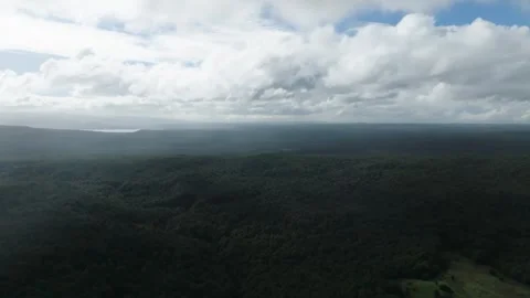 Aerial view Mountain Reflections on Calm Water Under a Cloudy Sky Stock Footage 312747059