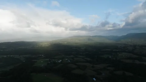 Aerial view Mountain Reflections on Calm Water Under a Cloudy Sky Stock Footage 312747878