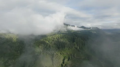 Aerial view Mountain Reflections on Calm Water Under a Cloudy Sky Stock Footage 312747976