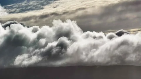 Aerial view Mountain Reflections on Calm Water Under a Cloudy Sky Stock Footage 312748396