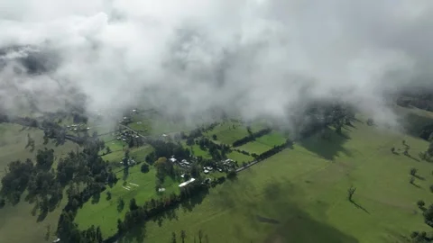 Aerial view Mountain Reflections on Calm Water Under a Cloudy Sky Stock Footage 312751282