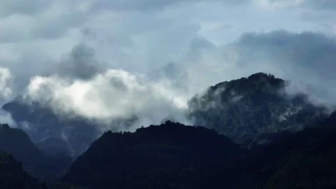 Aerial view Mountain Reflections on Calm Water Under a Cloudy Sky Stock Footage 312751638