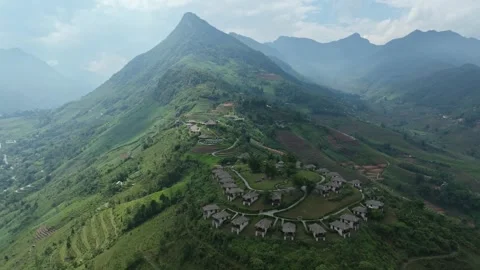 Aerial view of mountain resort in Sa Pa amid terraced valleys and Hoang Lien Son Stock Footage 340024794