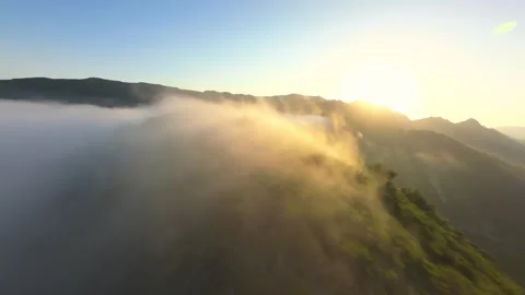 Aerial View of a Mountain Ridge Enveloped in Morning Mist Stock Footage 301066833