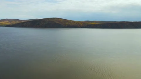 Aerial view of Mountain Ridge With Forest near to River in Gold Autumn Stock Footage 165471502