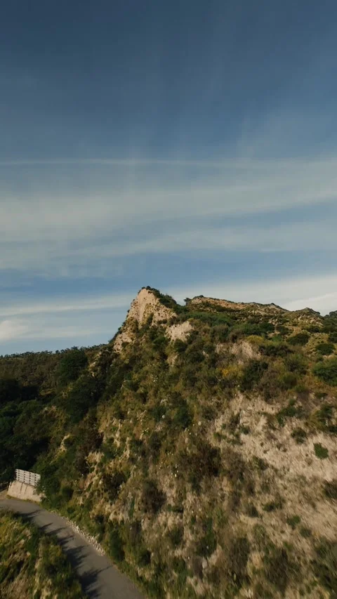 Aerial view of mountain ridge under blue sky Stock Footage 336194754