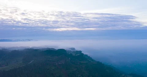 Aerial View of Mountain Ridges Covered in Morning Mist at Sunrise Stock Footage 342237771