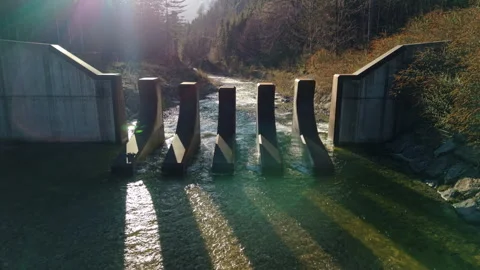 Aerial view of mountain river and dam with lens flare at sunset light, Austria Vídeos de archivo 333214352