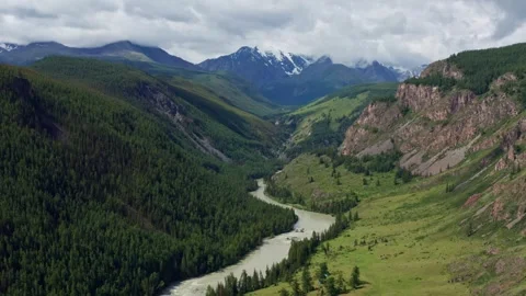 Aerial view of the mountain river between the mountains Stock Footage 317714859