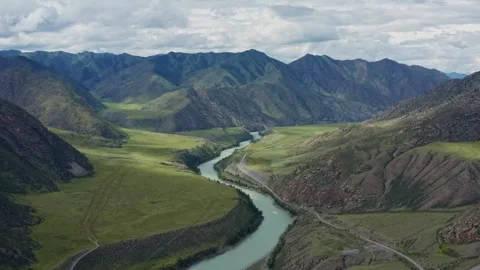 Aerial view of the mountain river between the mountains Stock Footage 317715499