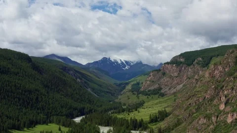 Aerial view of the mountain river between the mountains Stock Footage 317743114