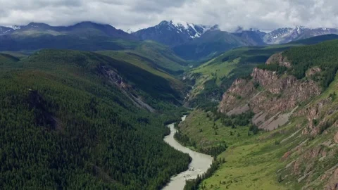 Aerial view of the mountain river between the mountains Stock Footage 317743178