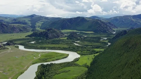 Aerial view of the mountain river between the mountains Stock Footage 317743200