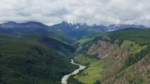 Aerial view of the mountain river between the mountains Stock Footage 317743207