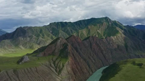 Aerial view of the mountain river between the mountains Stock Footage 317743332