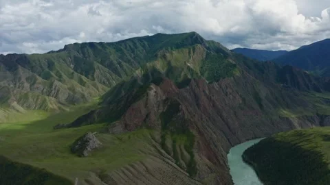 Aerial view of the mountain river between the mountains Stock Footage 317743355