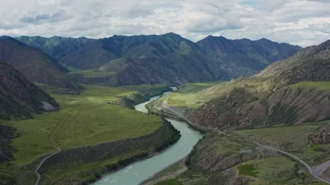 Aerial view of the mountain river between the mountains Stock Footage 317743370