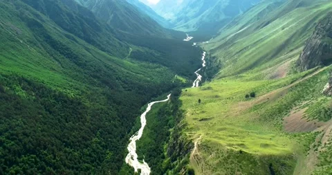 Aerial view of a mountain river flowing through a mountain gorge. Stock Footage 157729876