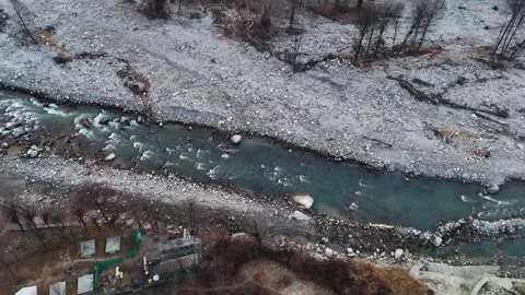 Aerial View of Mountain River Flowing Through Dry Winter Landscape Stock Footage 340966893