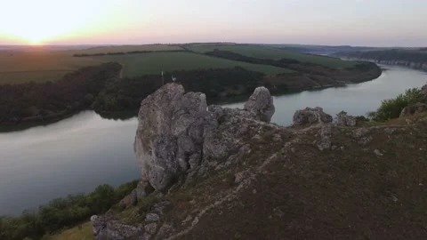 Aerial view. Mountain river flows through highest rocks. Landscape. Stock Footage 211808197