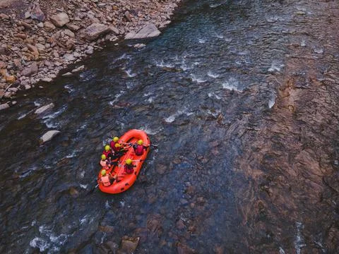Aerial view of mountain river people rafting in creek Stock Photos